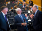 Professor John Farmer, center benefactor Paul Miller, and President Barchi talk before the symposium